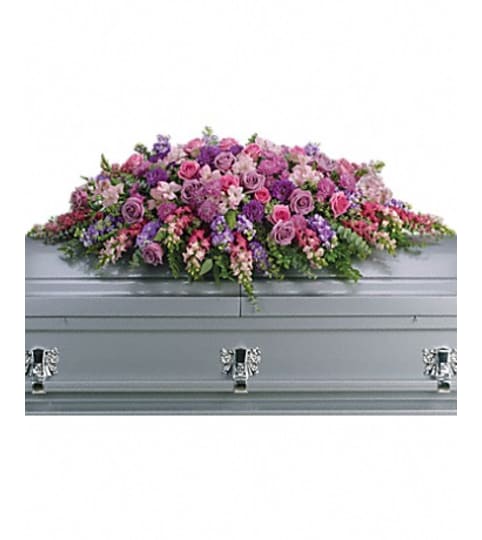 lavender casket spray. An arrangement by Fine's Flowers.