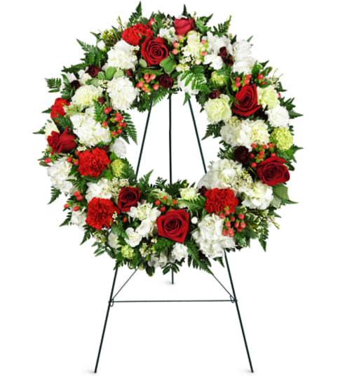 Passionate Faith Sympathy Wreath™. An arrangement by Fine's Flowers.