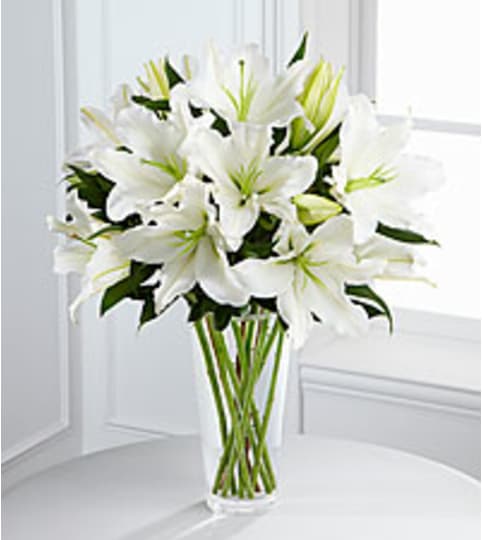 white in your honor. An arrangement by Fine's Flowers.