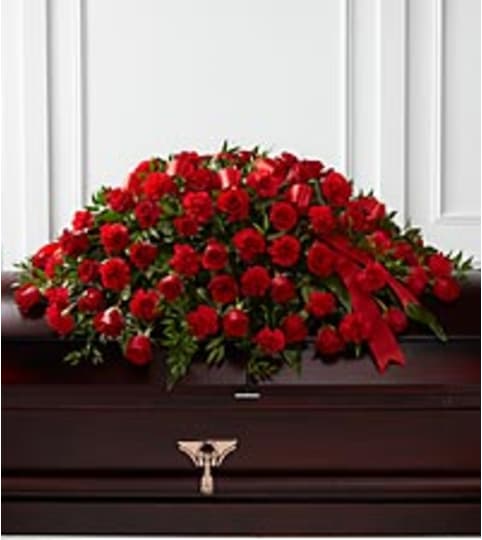 Dearly Cared For Casket Spray. An arrangement by Fine's Flowers.