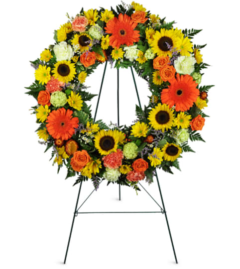 Heavenly Dawn Sunflower Wreath™. An arrangement by Fine's Flowers.