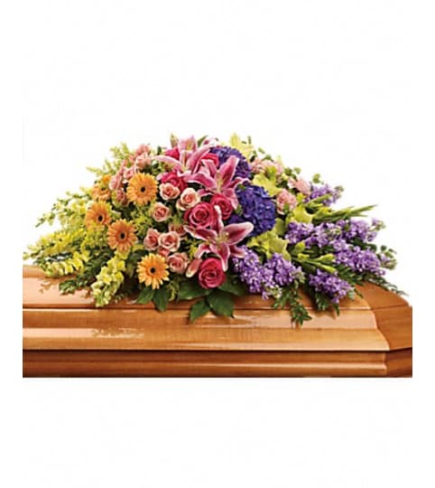 sweet memories casket spray. An arrangement by Fine's Flowers.